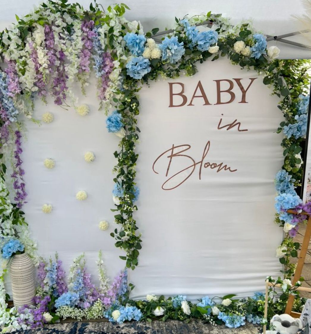 Floral backdrop for a baby shower celebration